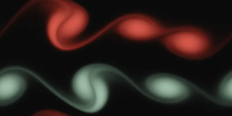 Two horizontal shear layers rolled up into rows of spiral vortices on a black background: the upper row in red (negative vorticity), the lower row in green (positive vorticity), thin filaments wrapping around each core.